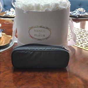 Small grey Tumi travel case